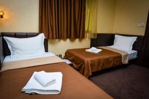 A bed or beds in a room at Guest house VRAZHDEBNA