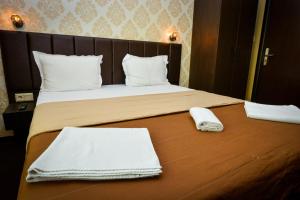 A bed or beds in a room at Guest house VRAZHDEBNA