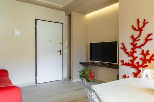 TV a/nebo společenská místnost v ubytování Suite Isavì
