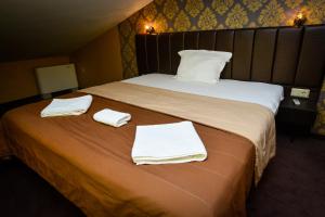 A bed or beds in a room at Guest house VRAZHDEBNA