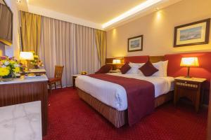 Postel nebo postele na pokoji v ubytování Hotel Flamenco Cairo