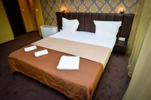 A bed or beds in a room at Guest house VRAZHDEBNA
