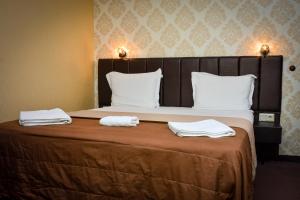 A bed or beds in a room at Guest house VRAZHDEBNA