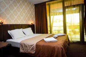 A bed or beds in a room at Guest house VRAZHDEBNA
