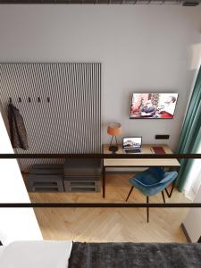 TV a/nebo společenská místnost v ubytování Da Home Urban Hotel self check-in