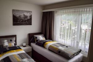 Säng eller sängar i ett rum på Apartments Alpenfirn Saas-Fee