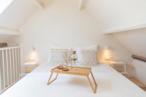 Postel nebo postele na pokoji v ubytování Op Oost Boutique hotel & Restaurant het Kook Atelier