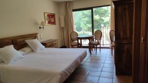 Posteľ alebo postele v izbe v ubytovaní La Figuerola Hotel & Restaurant