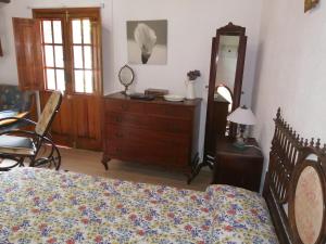 A bed or beds in a room at Casa Rural Aborigen Bimbache