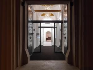 a hallway leading into a building with a doorway at The Gold Bank in Prague