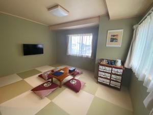 TV a/nebo společenská místnost v ubytování Shirahama no Yado Ran