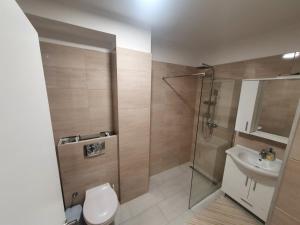Koupelna v ubytování Apartman Telalović + 6 fotografií