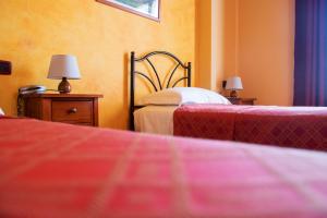 Letto o letti in una camera di Agriturismo Ai Due Volti