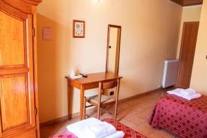 Letto o letti in una camera di Agriturismo Ai Due Volti