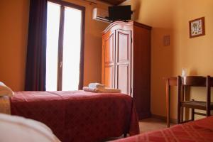 Letto o letti in una camera di Agriturismo Ai Due Volti
