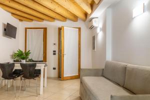 a living room with a couch and a table at Residence Garibaldi in Trieste