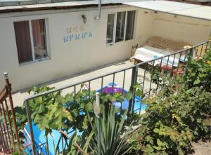 a balcony of a house with a swimming pool at Like Home Guesthouse in Yerevan