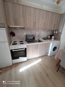 A kitchen or kitchenette at Vacations in Corfu-Antiperni by CorfuEscapes