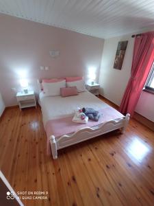 A bed or beds in a room at Vacations in Corfu-Antiperni by CorfuEscapes