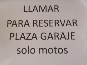 a sign that says panara reserve plazaarios and solo modes at Hostal Palafox in Barbastro