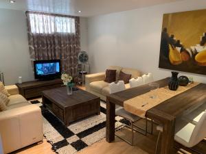 a living room with a couch and a table at Quickcasaspain sl in Rojales