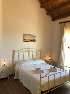 Letto o letti in una camera di B&B SiciliAntica