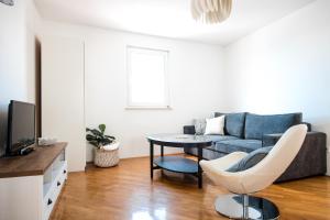 TV a/nebo společenská místnost v ubytování PortHouse Apartments