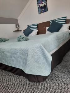 Posteľ alebo postele v izbe v ubytovaní Kamilla Apartman Villapark