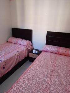 A bed or beds in a room at شاليهات للعائلات بمنتجع ريتال فيو الساحل الشمالى