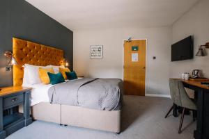 Katil atau katil-katil dalam bilik di Crooklands Hotel