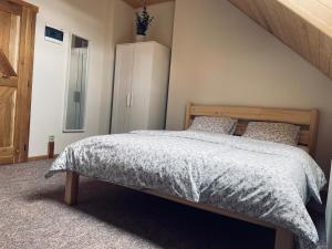 Postel nebo postele na pokoji v ubytování Selská chalupa Anetka