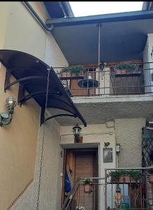 a black umbrella hanging from the side of a building at Casa Chiara in Nus