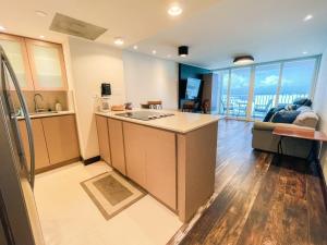 a kitchen and living room with a view at ESJ Towers by Chana in San Juan