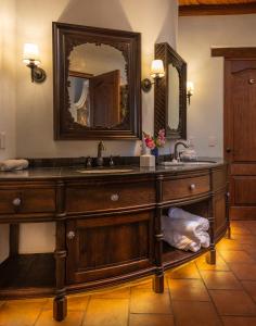 a bathroom with a wooden sink and a mirror at Hotel Boutique Casa Colorada in Pátzcuaro +30 photos