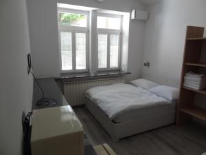 
A bed or beds in a room at Tabor - Apartments Rozmanova Street
