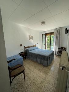 Postel nebo postele na pokoji v ubytování Hostal Ter