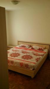 a bedroom with a bed with two pillows on it at PashaNo1 in Sarajevo