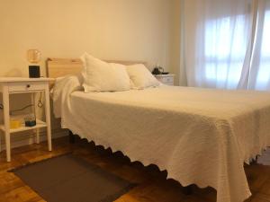 A bed or beds in a room at Casa en la playa
