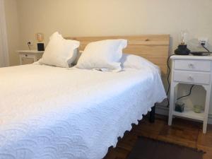 A bed or beds in a room at Casa en la playa