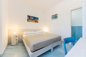 Postel nebo postele na pokoji v ubytování Poseidonia Rooms