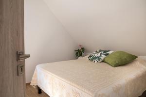 A bed or beds in a room at Stay Veszprèm, modern city center flat