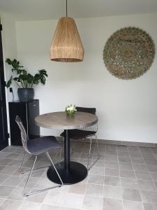 a table and two chairs in a room at Studio Bourbon in Veere