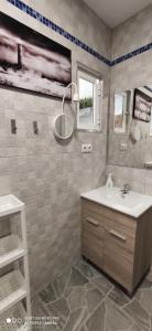 a bathroom with a sink and a mirror at Huelintown in Málaga