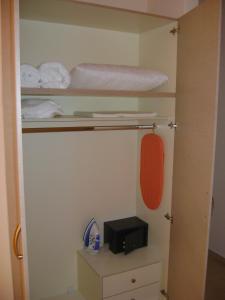 a room with two bunk beds and a microwave at Vasso's Studios in Vasiliki