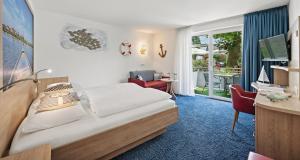 Un pat sau paturi într-o cameră la Gasthaus Schiff