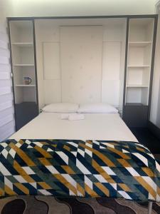 Ένα ή περισσότερα κρεβάτια σε δωμάτιο στο Bar Exclusiv Soho city Residence