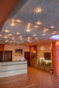 a lobby with a ceiling with lights on it at Idi Hotel in Zarós