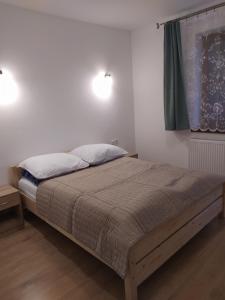 Posteľ alebo postele v izbe v ubytovaní Gackówka