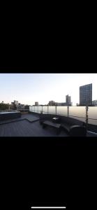 a view of a city from the roof of a building at Swan Street Townhouse Hot Tub & Roof Terrace in Manchester