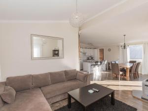 a living room with a couch and a table at St Helenas 5 Twynam Street in Jindabyne